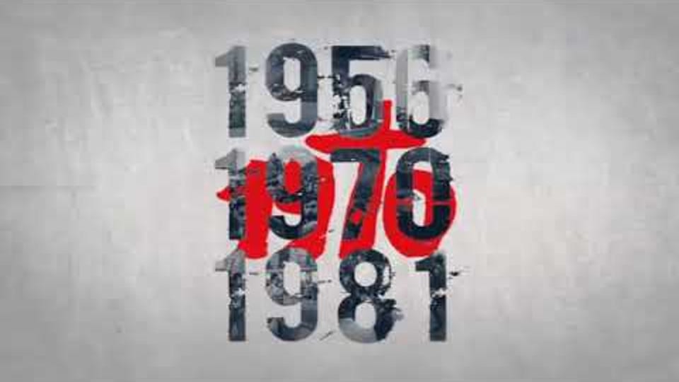 Video thumbnail — the years 1956, 1970 and 1981 in worn stencil type on concrete, 1970 picked out in red.